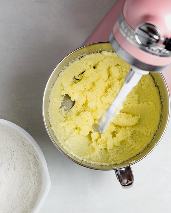 sugar and butter fluffy in the bowl of a stand-alone mixer