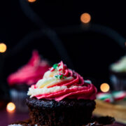 chocolate peppermint cupcakes surrounded by candy canes