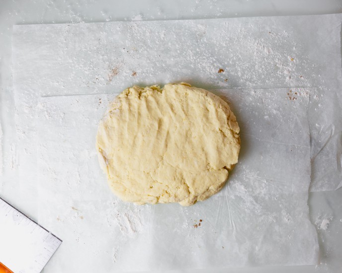 The gluten free cinnamon dough on parchment paper. 